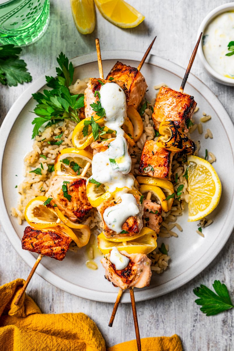 These juicy salmon kabobs with lemon are perfect for grilling! Serve with garlicky yogurt dipping sauce for a delicious and easy summer meal.  #recipes  diethood.com/grilled-salmon…