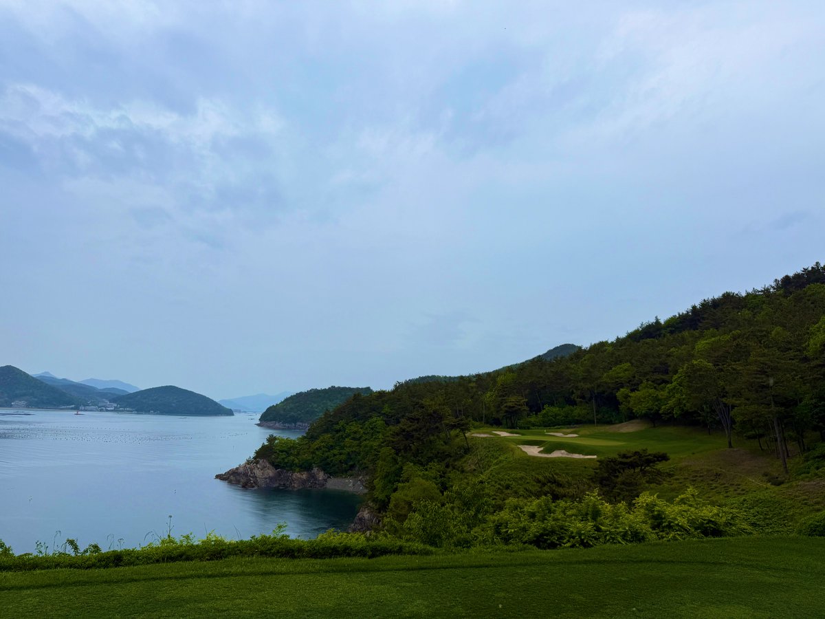 Top100Rick's tweet photo. South Cape Owners Club
Kyle Phillips - 2013 
Namhae, South Korea 

Truly one of the most epic places you could play golf on our globe, South Cape is a treat for all the senses. 

This luxurious resort has it all. But this post will be about the golf course, not the perfection that is everything else. 

The course is cut into rugged cliffs along the sea, certainly an engineering and routing challenge from the beginning. Kyle did an amazing job finding a playable golf course. 

The sea holes steal the show. The 3 par 3’s on the water are all world class. It’s rare for an ocean course to allow you to play over the actual ocean multiple times. 

You can see the ocean from the entire course, but you’d be amiss to think it’s just the views that are interesting. The golf holes are fun and strategic, with plenty of risk and reward awaiting. Aesthetically Kyle did his typical great job with the visuals.

The greens are fun with lots of slopes and run offs. The constant rock outcroppings provide wonderful visuals and sometimes they are in play.

The only thing missing is firm turf, which I imagine is a struggle with this mountain soil, it’s the only thing keeping it from competing with the greatest seaside courses of the world.

Cape Owners is a fantastic course and the epic heroic shots you take you will remember forever. IMO it’s a top 100 world level 18 holes and truly a trek worth making. A magical place!