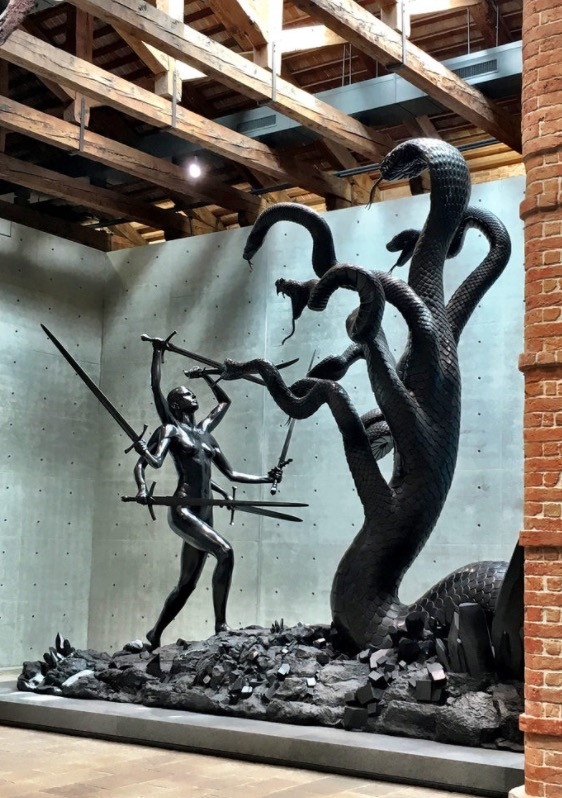 this was during the 2017 venice biennale, the one where anne imhof sweatshopped a bunch of precarity-class creatives in the deutsche pavilion for several months and won the golden lion

hirst blowing £50m to play warhammer with imperial-sized bronze casts was far more compelling