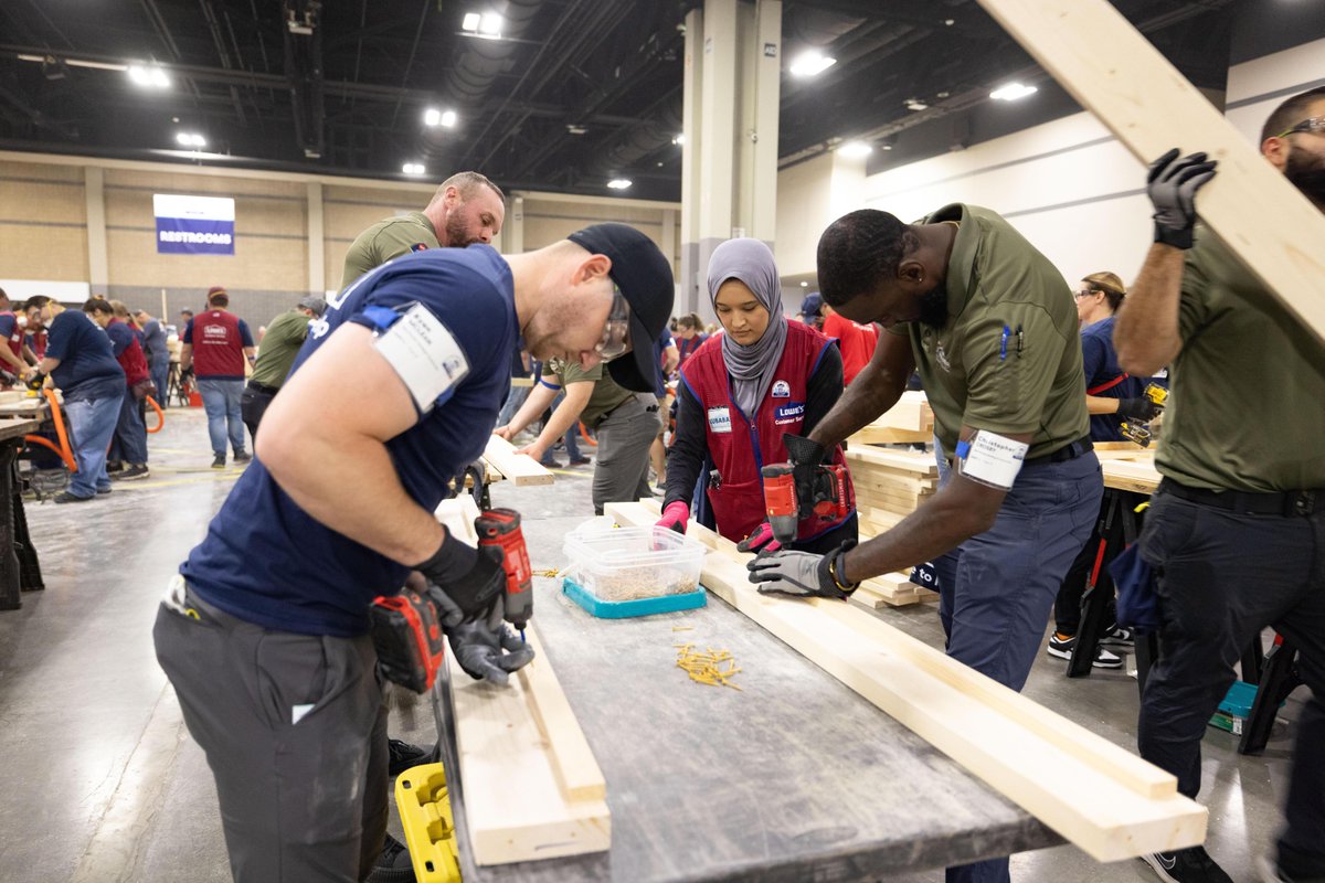 Lowes's tweet image. Today in our hometown, a team of thousands are showing up for 24 hours straight with hammers in hand to build a record-breaking number of beds with @SHPbeds for children in need. It's #HowLowesHelps 💙