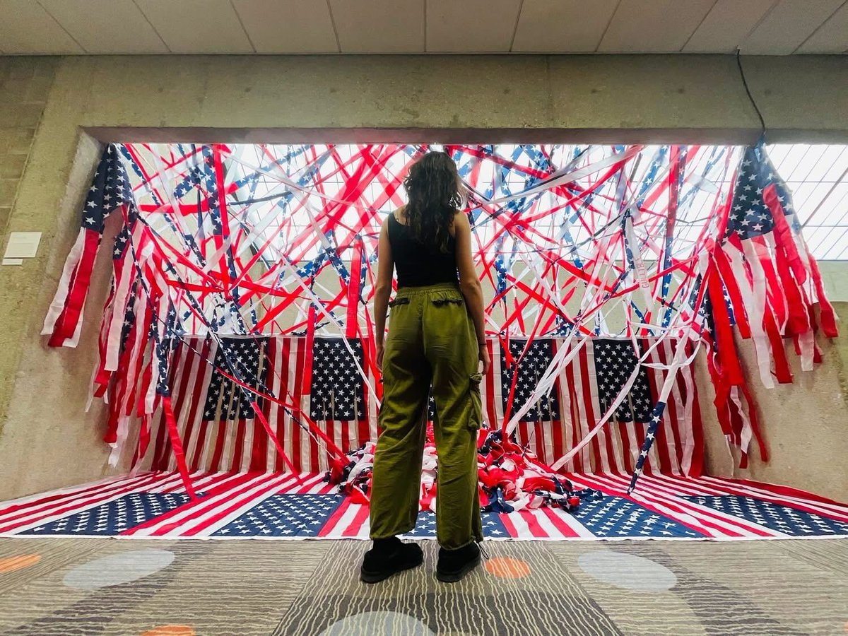 usishield's tweet image. Bailey Roby, senior fine arts major, removes interactive political artwork amid controversy and community backlash. 

Photo courtesy of Bailey Roby