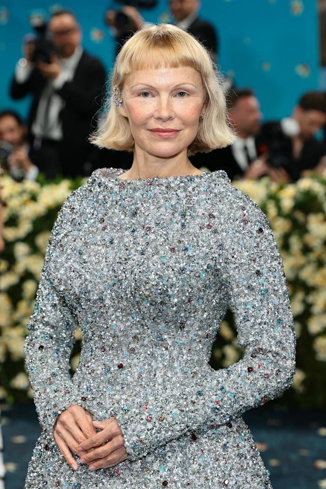 Pamela Anerson proves you can be 57, not wear (much) makeup, be modest, and still be beautiful: