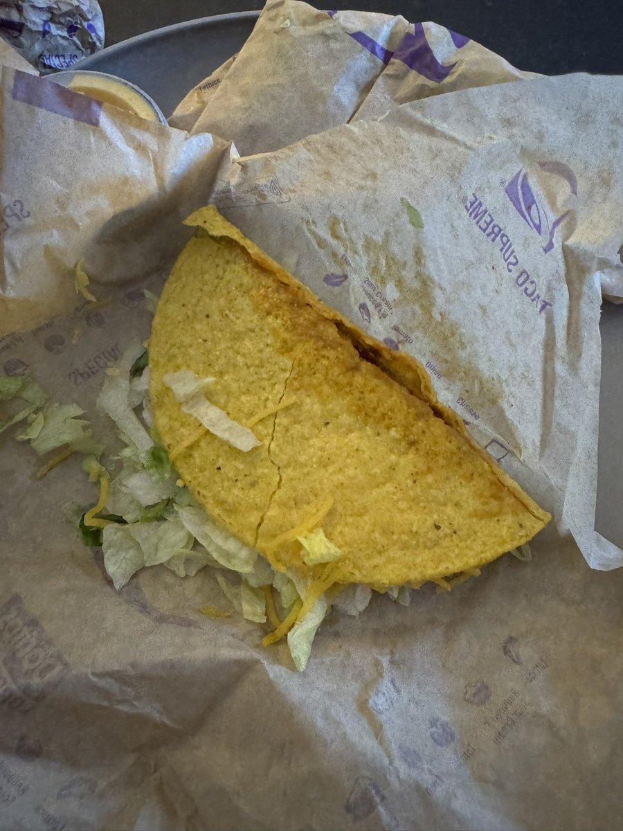 braunrl's tweet photo. @tacobell what an absolute joke. no meat. completely broken. this has to change. not even edible at this point. lots of money for 3 tacos for them to be this way. https://t.co/SwHOFHCDt9