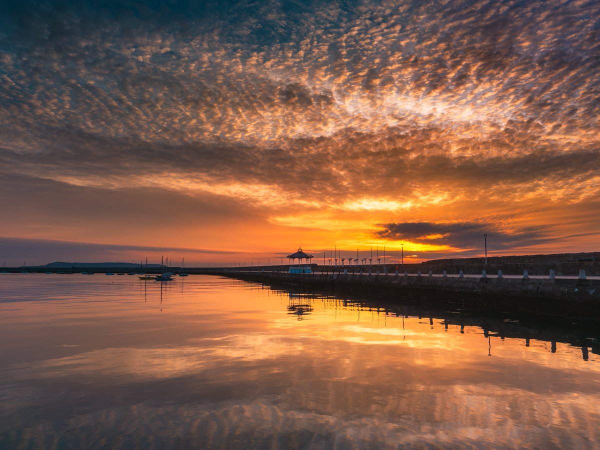Picturesque sunrise sky reflections at Dún Laoghaire East Pier this morning.