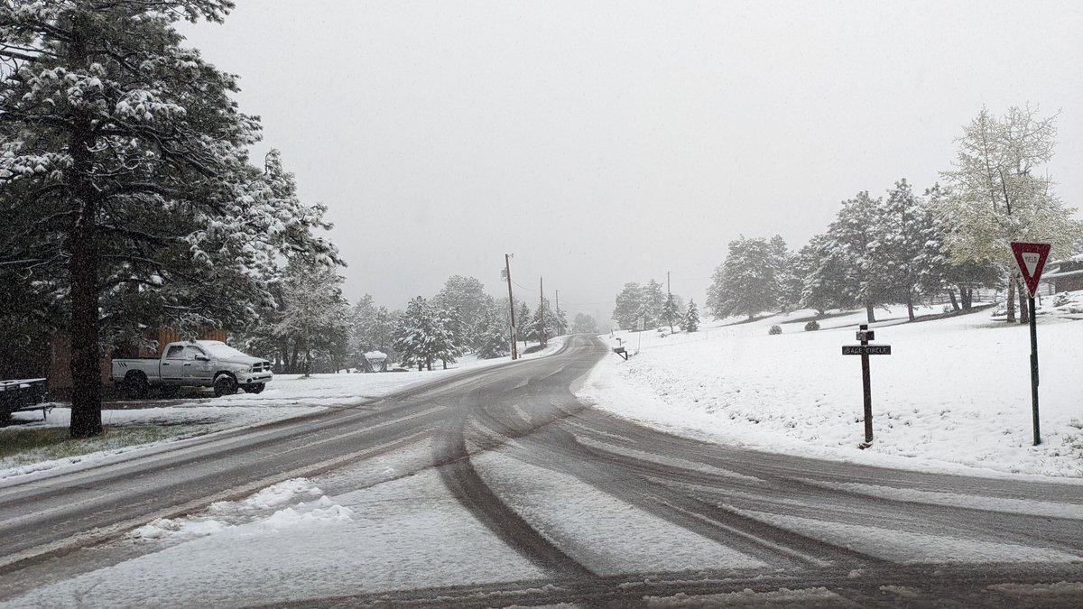 Wet, dense snowfall in Evergreen this morning . . . 3.4" of it at an elevation of 7,400 feet. Much of it has melted. Good to get the spring moisture. Side streets are slush covered in spots. #cowx