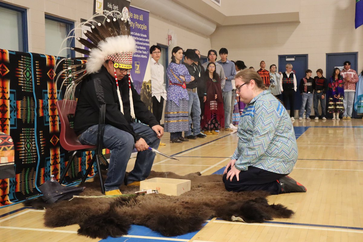 Holy Spirit Catholic School Division (@holyspiritrcsd) on Twitter photo On May 6, <a href="/cchschool/">Catholic Central</a> held a beautiful Feather & Métis Sash Blessing Ceremony to honour our FNMI students ahead of their graduation on May 10.
Families, friends, and community members gathered as Blackfoot Elder Kendrick Fox, Naatoiipiksi (Holy Hitter), led the blessings. On May 6, <a href="/cchschool/">Catholic Central</a> held a beautiful Feather & Métis Sash Blessing Ceremony to honour our FNMI students ahead of their graduation on May 10.
Families, friends, and community members gathered as Blackfoot Elder Kendrick Fox, Naatoiipiksi (Holy Hitter), led the blessings.