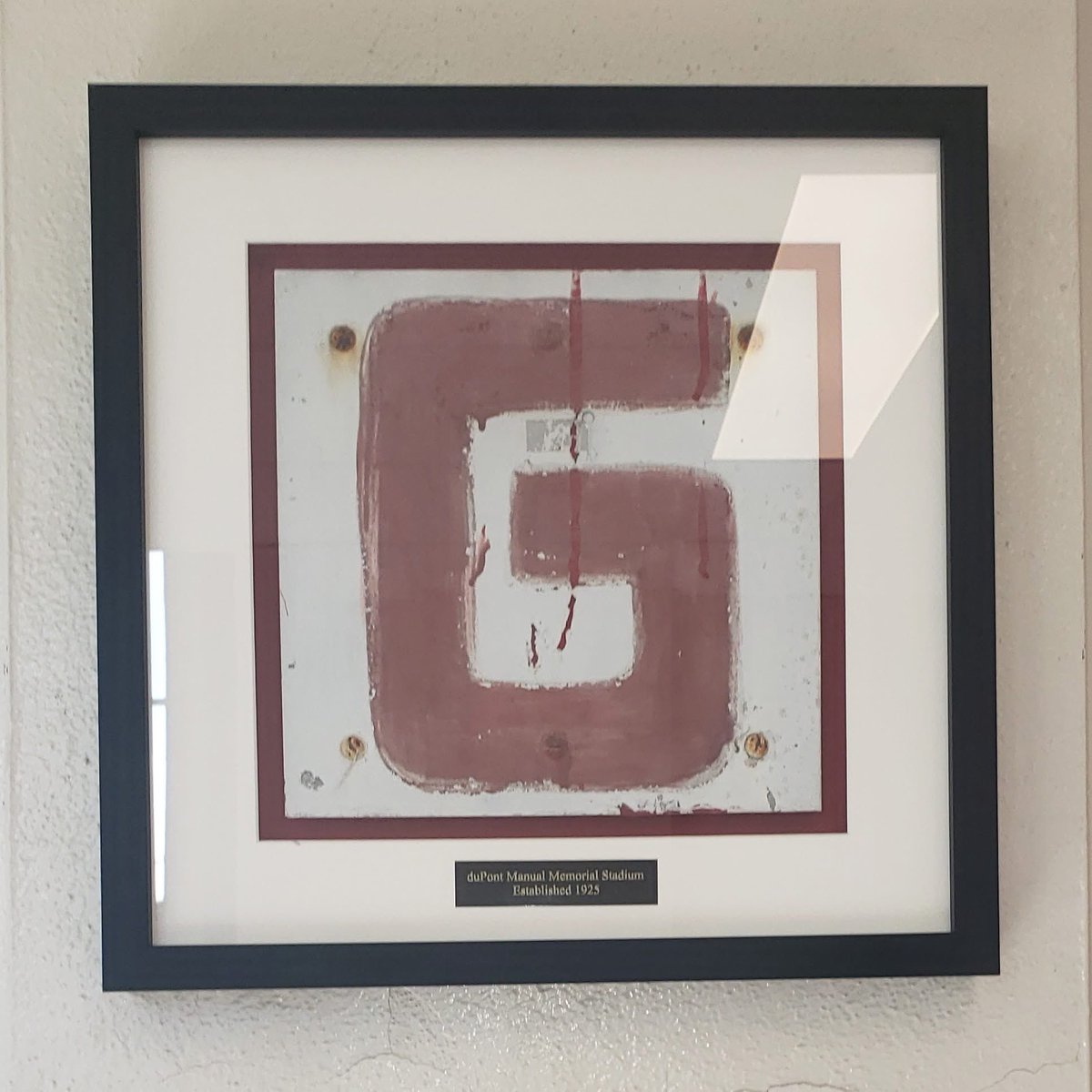 To support the duPont Manual Memorial Stadium renovation. The Alumni Association and Athletic Department are gauging interest in auctioning or establishing a set amount to purchase these fence markers, circa 1950. This photo showcases the goal line marker hung near the cafeteria.