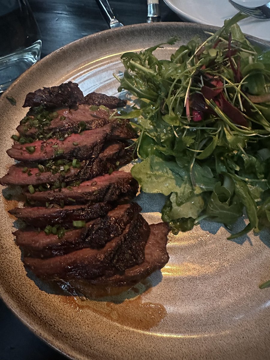 Perfectly seared, tender steak with a side of greens elegance on a plate 🥩🌿 
#SteakNight #FoodieGoals