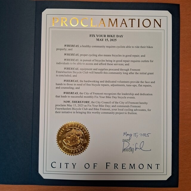 Wynn Kageyama (Fremont Freewheelers) and Andreas Kadavanich (Bike Fremont) receiving the Fix-you-bike-day proclamation from Fremont Mayor Raj Salwan at the May 6 council meeting.