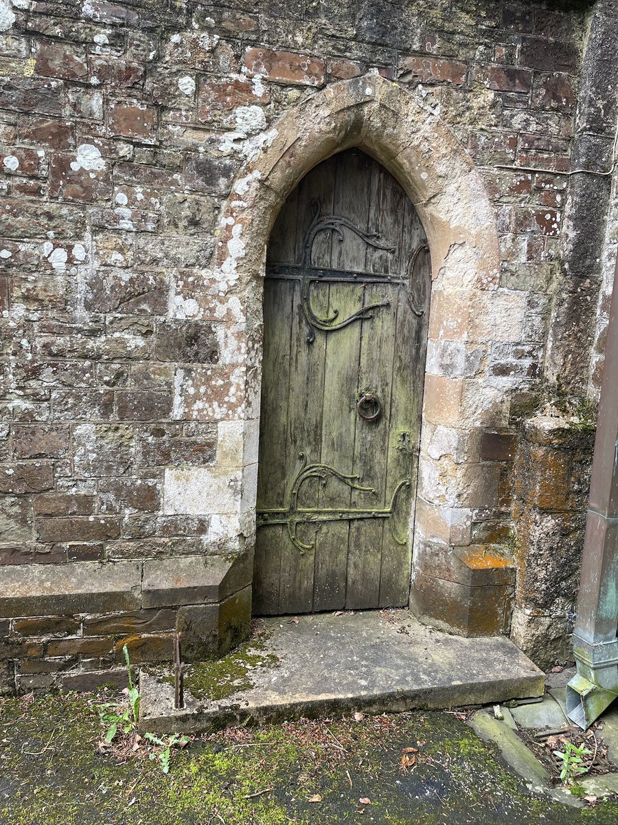 Elegant ironwork on a door at Church of All Saints, Winkleigh, Devon 

Are large hinges like these purely decorative or do they serve a purpose ? Eg do they keep the boards together as the wood shrinks with age? 

#AdoorableThursday #ironworkthursday