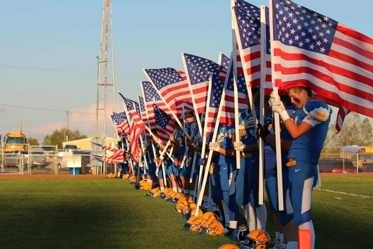 We've done this for about 8 years now. After running onto the field the boys line up along the North End Zone while the National Anthem is played.