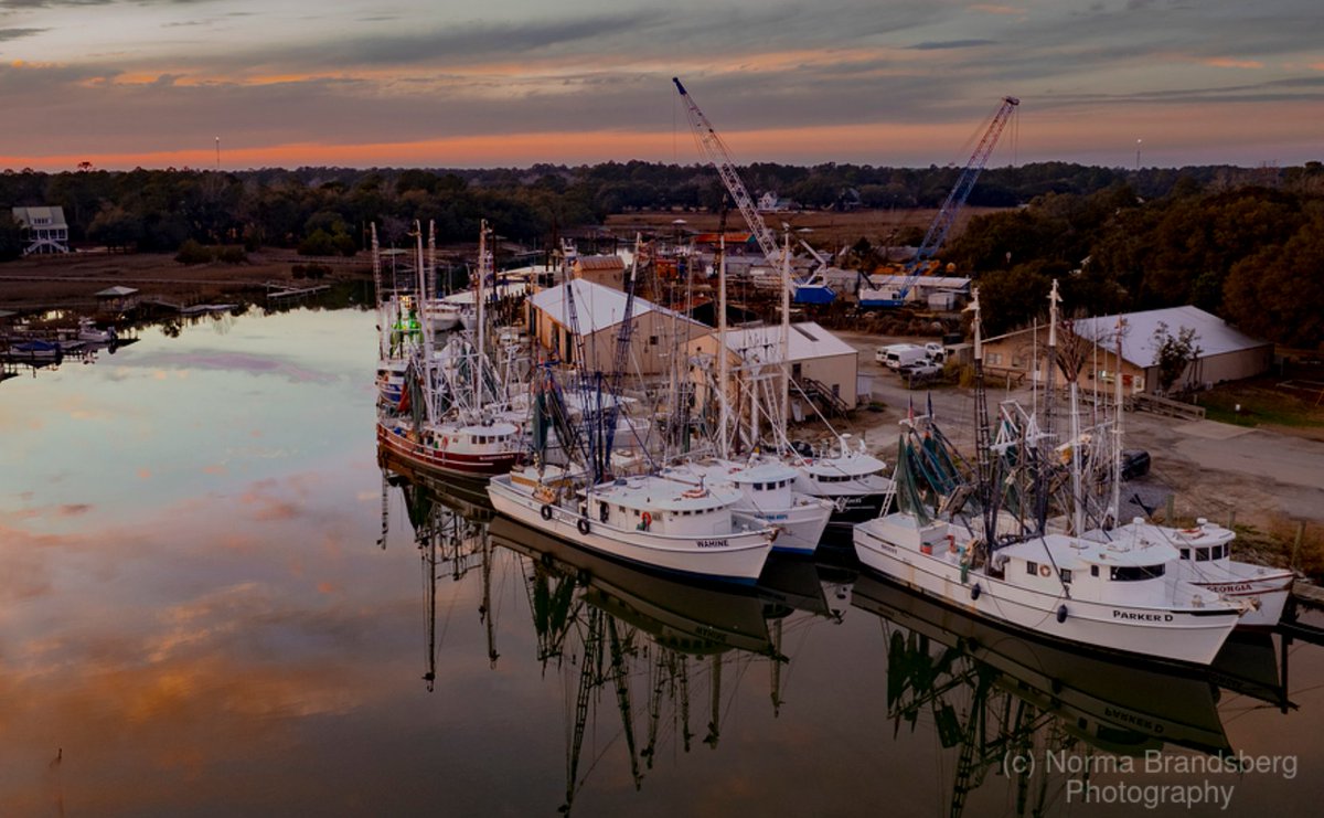 Magical South Carolina historic small working fishing village. Jeremy Creek, McClellanville shrimper boats sunset reflections, moored for the night north of Charleston!

#southcarolina #fishingvillage #ayearforart #sunset #reflections #historic #fineartphotography #fineart