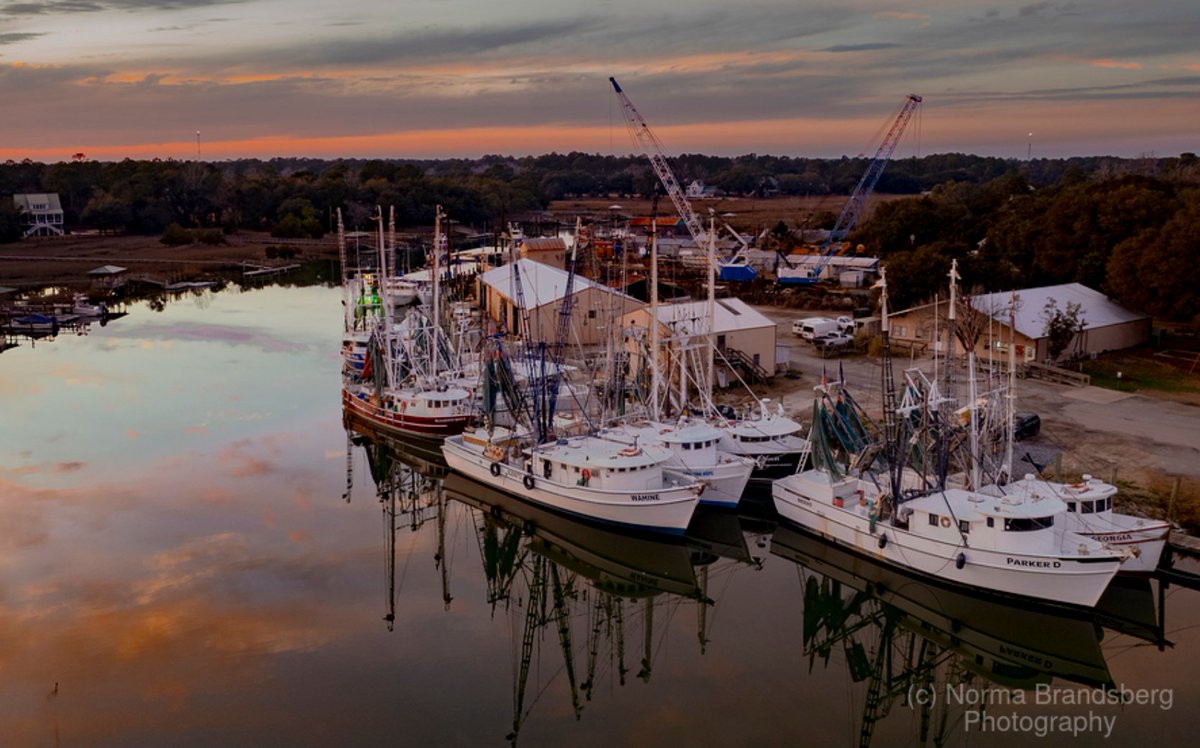 Magical South Carolina historic small working fishing village. Jeremy Creek, McClellanville shrimper boats sunset reflections, moored for the night north of Charleston!  

#southcarolina #fishingvillage #ayearforart #sunset #reflections #historic #fineartphotography #fineart