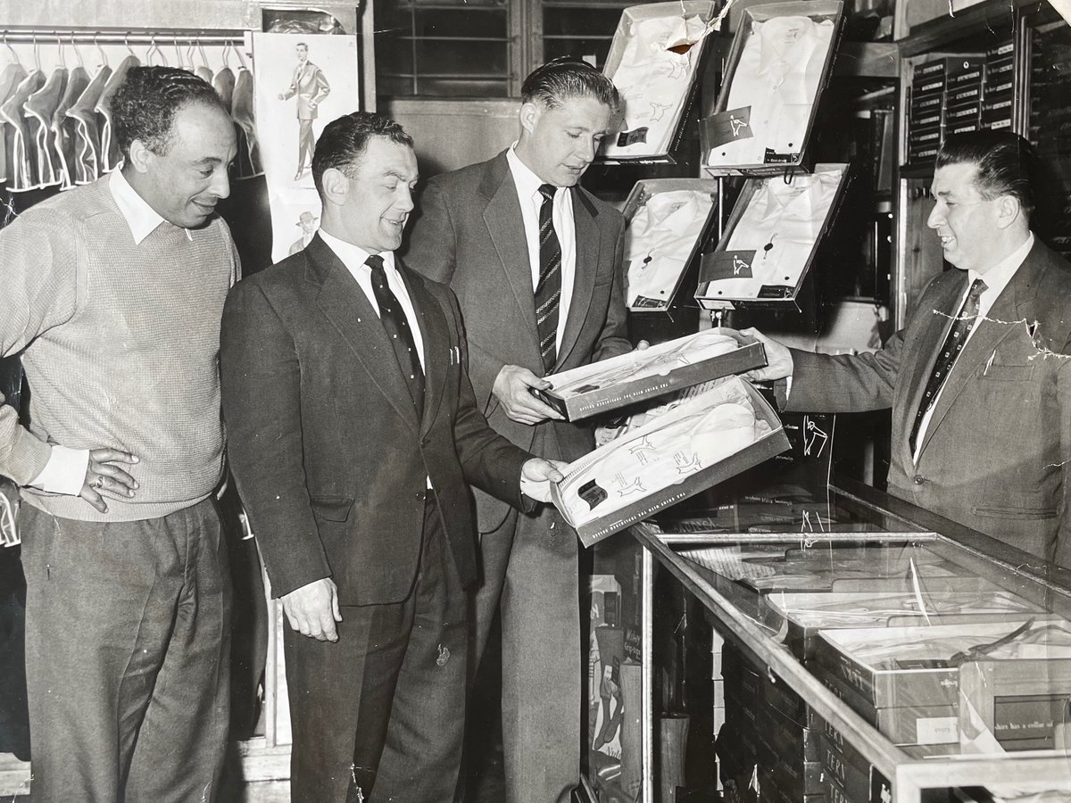 Roy Francis with <a href="/hullfcofficial/">Hull FC</a> players Tommy Harris &amp; Johnny Whiteley at a local tailors. Roy was a father figure to his players on and off the field, even advising them on dressing well. Find out more in my new bio, out 5 June bit.ly/3SjJsn9 #RugbyLeague #BlackHistory