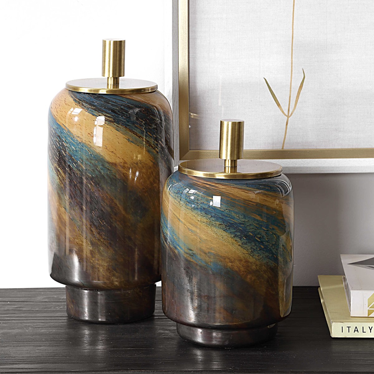 Shop <a href="/LampsPlus/">Lamps Plus</a> for fast, free shipping on these new #carolynkinder containers. These glass canisters are a blend of blues, caramels, and bronze metallic with a lift-off brass finished lid. #carolynkinder #uttermost lampsplus.com/products/utter…