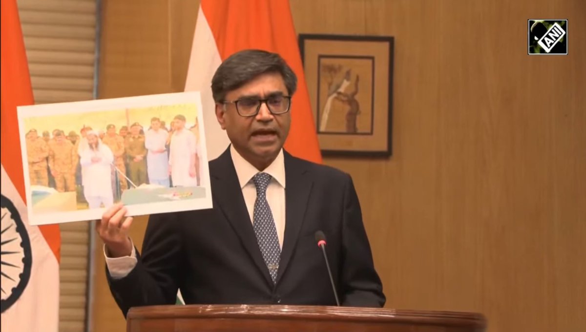 India questions Pakistan

If Pakistan doesn't support terrorism, why's Pakistan army standing with Terrorist Abdul Rauf and at funeral of Terrorists?