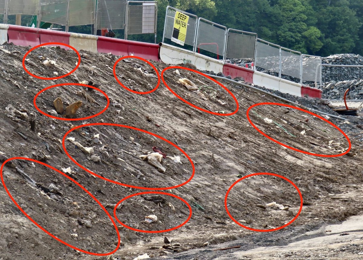 Evening light on the A2 roadworks for the Narrow Water Bridge exposes plastic, carpets, foam, piping, builders rubble and other rubbish buried in unauthorised groundworks carried out on the watch of Warrenpoint Harbour Authority during their efforts to expand Warrenpoint Port.
