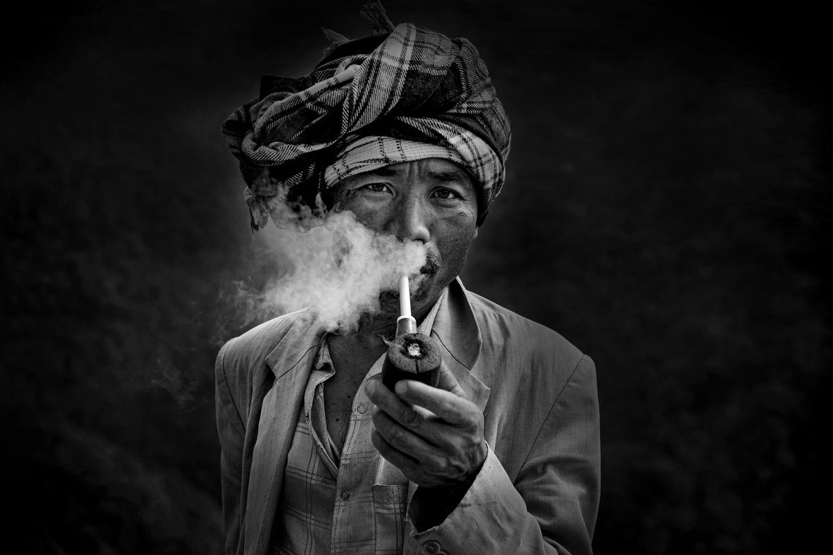 DigantaRajkho11's tweet photo. A Khasi man smokes through a traditional bamboo pipe in the rural hills of Meghalaya, India. The photograph reflects a quiet moment from daily life in the region’s remote communities.
©DRajkhowa/2016 https://t.co/gTnkjbomyV