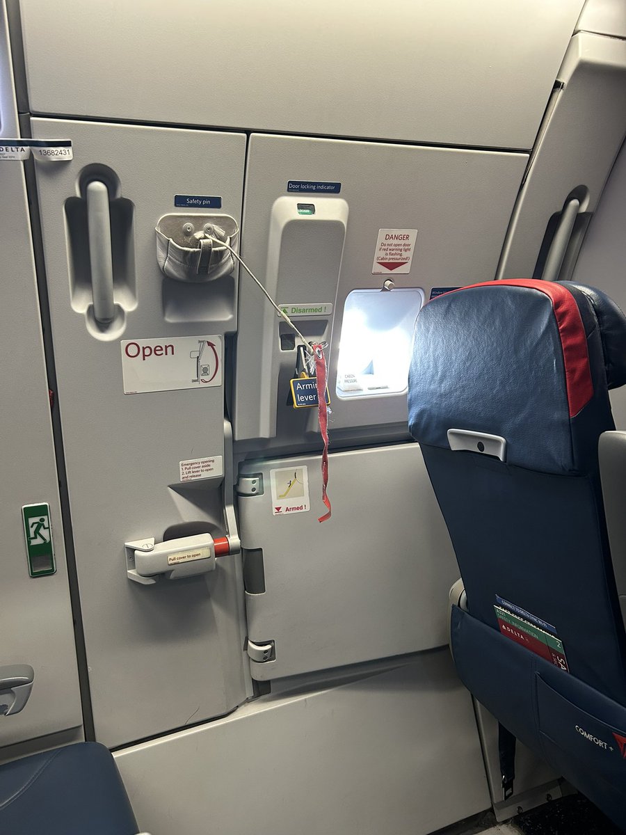 Hmmmm… <a href="/Delta/">Delta</a> is it normal to block exit rows with seats? I remember not being able to recline a seat and now you just put the seat partially blocking the door?