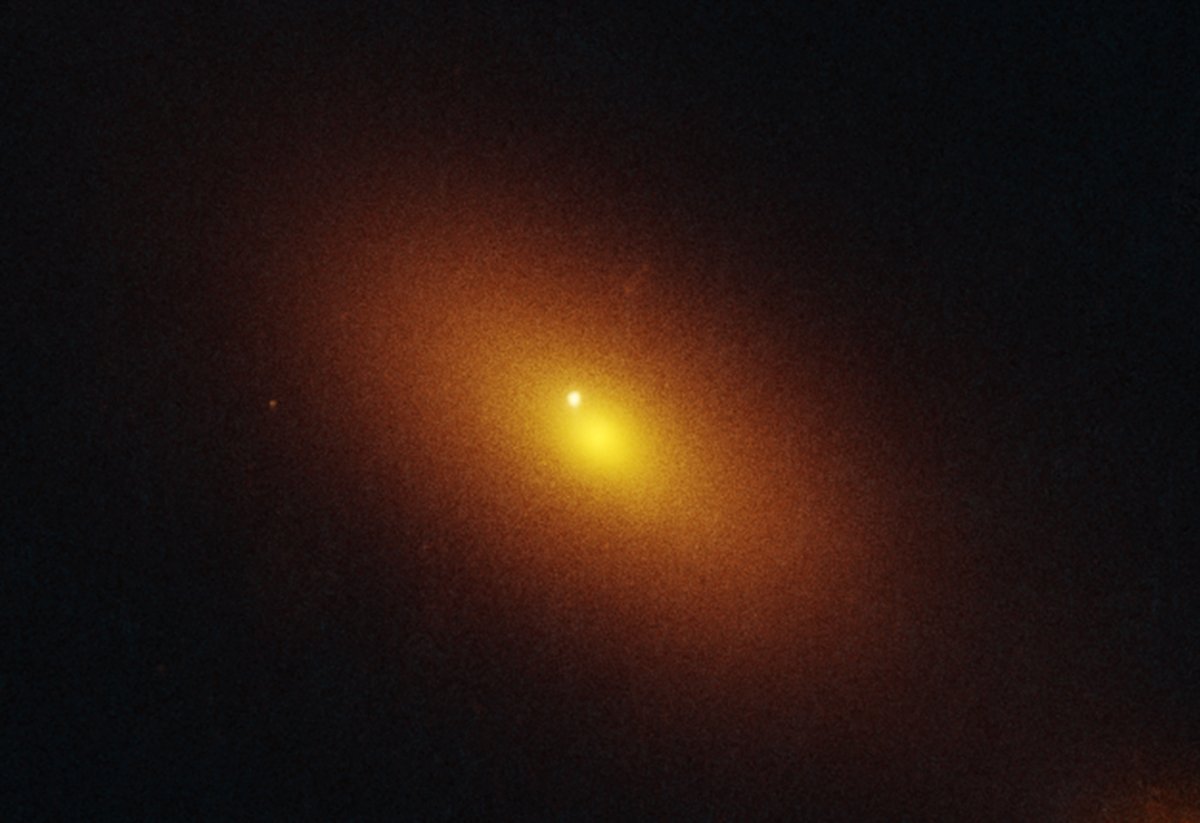 NASA's tweet image. A black hole revealed itself from 600 million light-years away when it ripped apart and swallowed a star. The resulting burst of radiation is the bright dot just off-center captured in this @NASAHubble image. go.nasa.gov/4jSwhWG