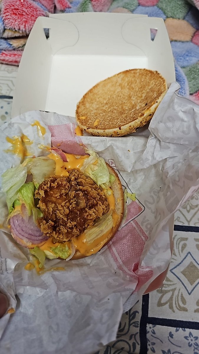 PrathameshHade's tweet photo. @KFC_India @kfc why even you offer this much portion of chicken, instead only provide the bun. This is clear loot. https://t.co/4ScJcUpPzW