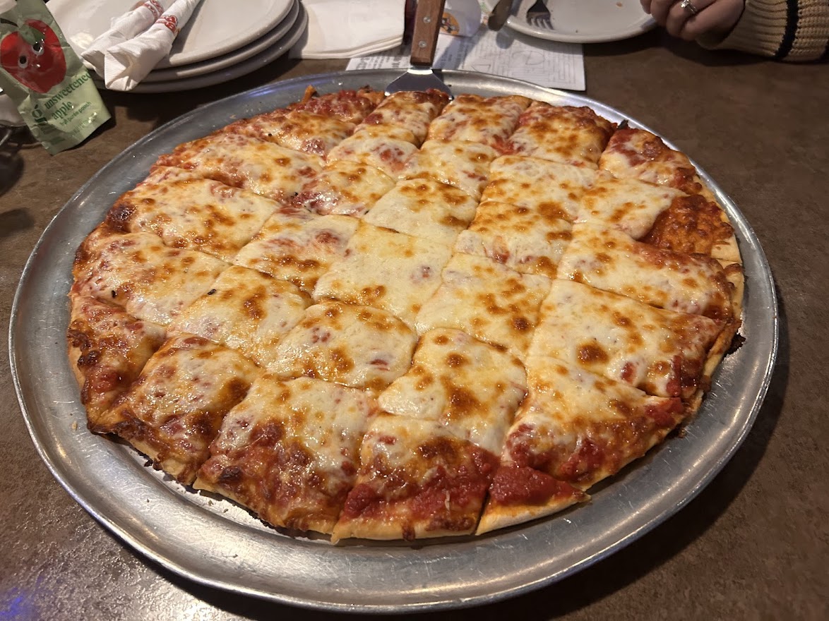 Chicago pope to teach Italians how to slice pizza the proper way