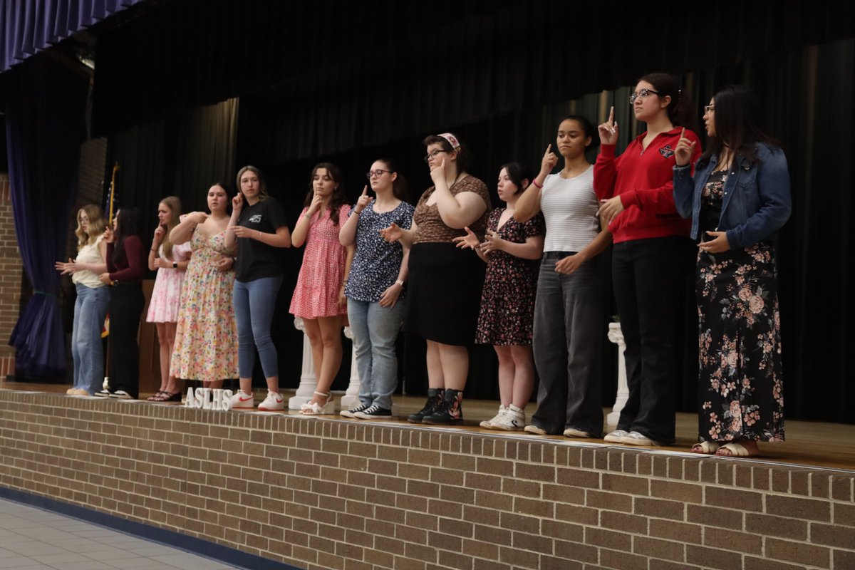 ASL students sign their pledge to the American Sign Language Honors Society. Today the ASL program hosted its first induction ceremony at LHS.