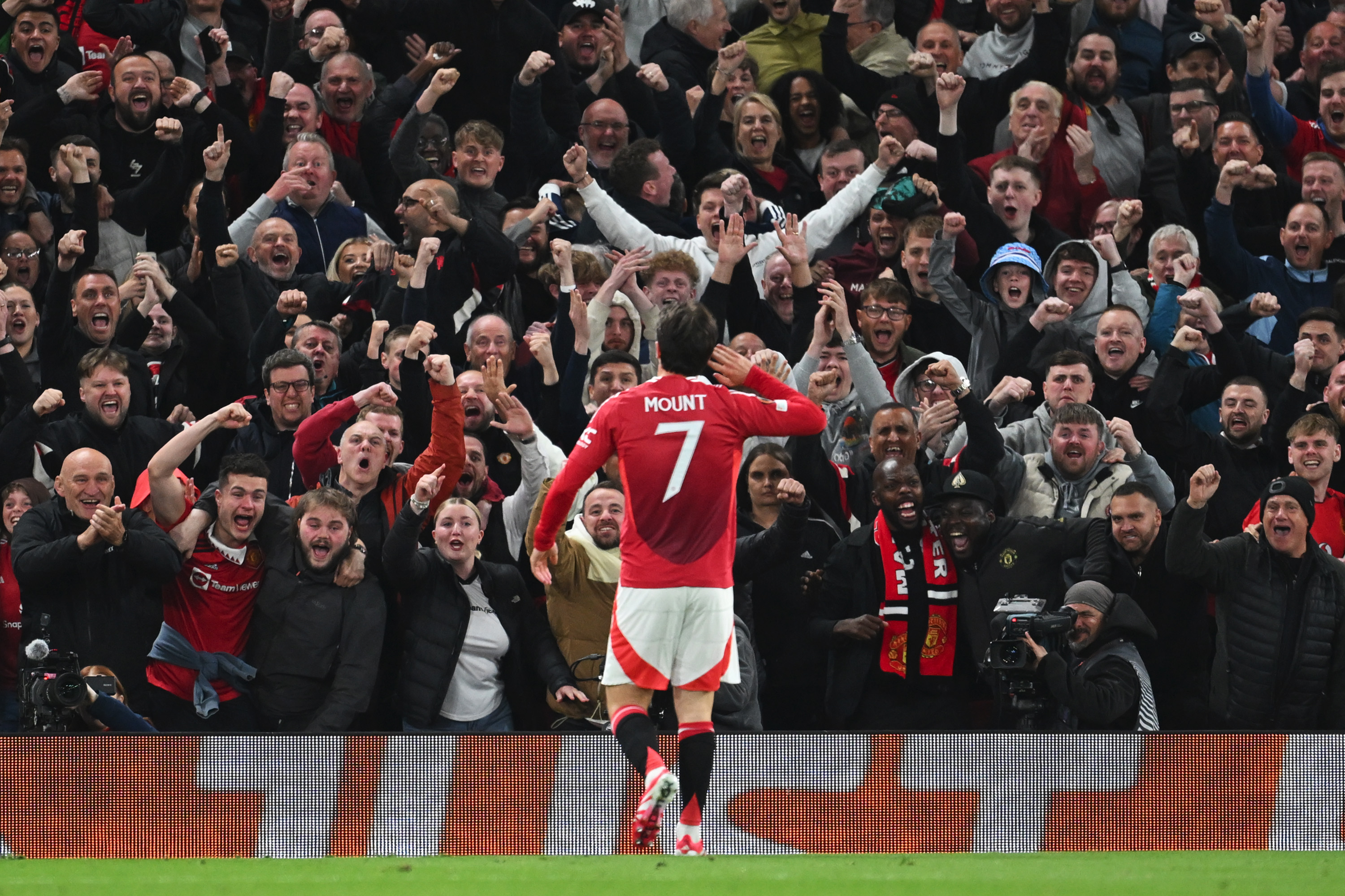 Mason Mount celebrates one of his goals in front of the Old Trafford crowd.