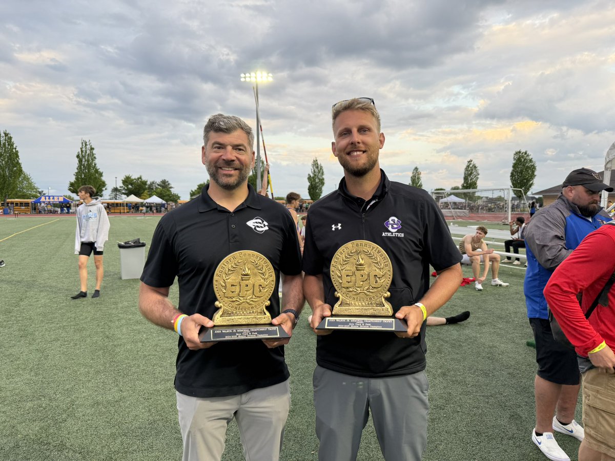 The Cavalier coaches Krammes and Yeomans accept the Monroe Divisional Championship trophy today