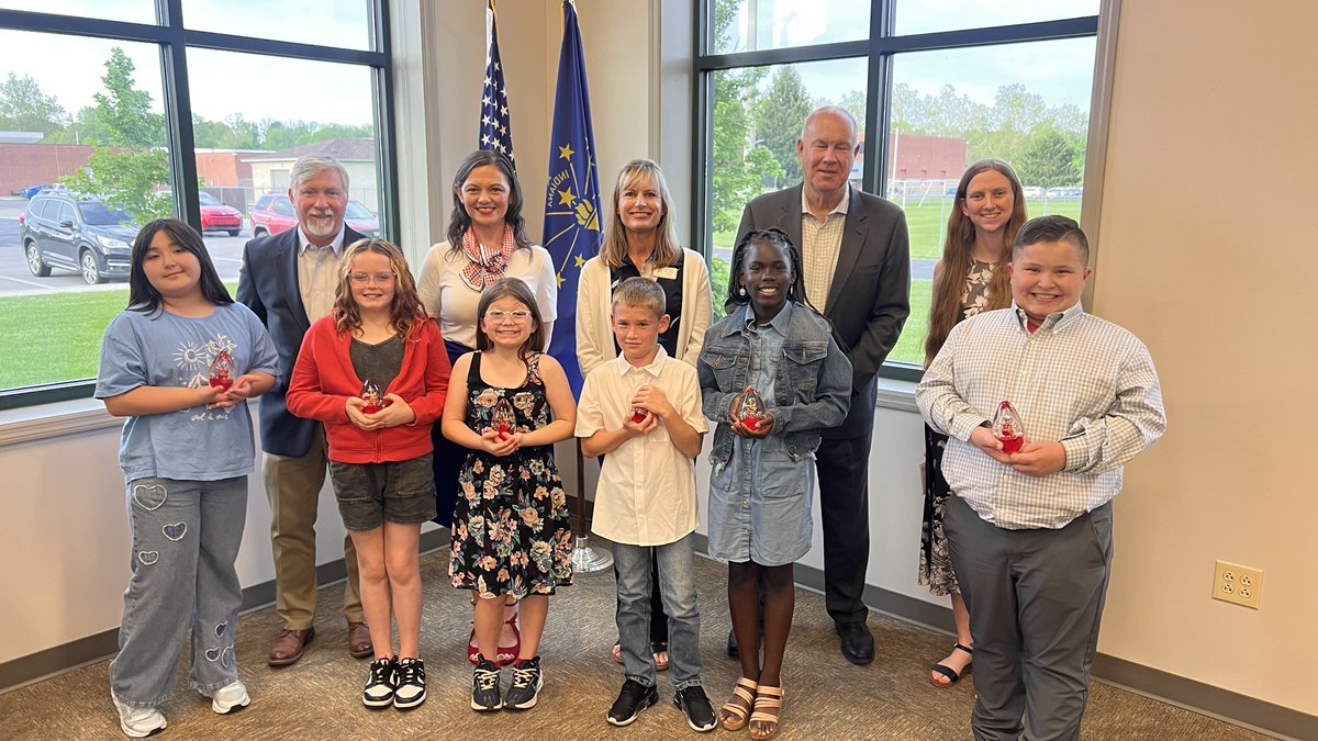 These are the students honored tonight, along with the school board. #LoveOurStudents #QuakerFaces #RedPride