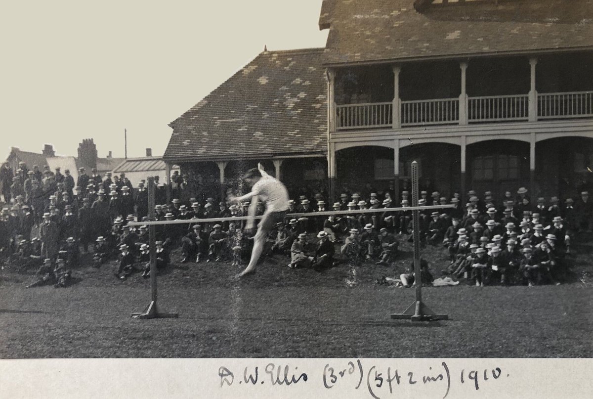 ReptonArchives's tweet image. The annual sports competition in 1910 lasted three days. Here's a great shot of Donald Ellis (Priory '05) in front of the old pavilion. To the left of it is the roof of the Fives Court, demolished months later to make way for the grey stone classrooms now known as Furneaux School