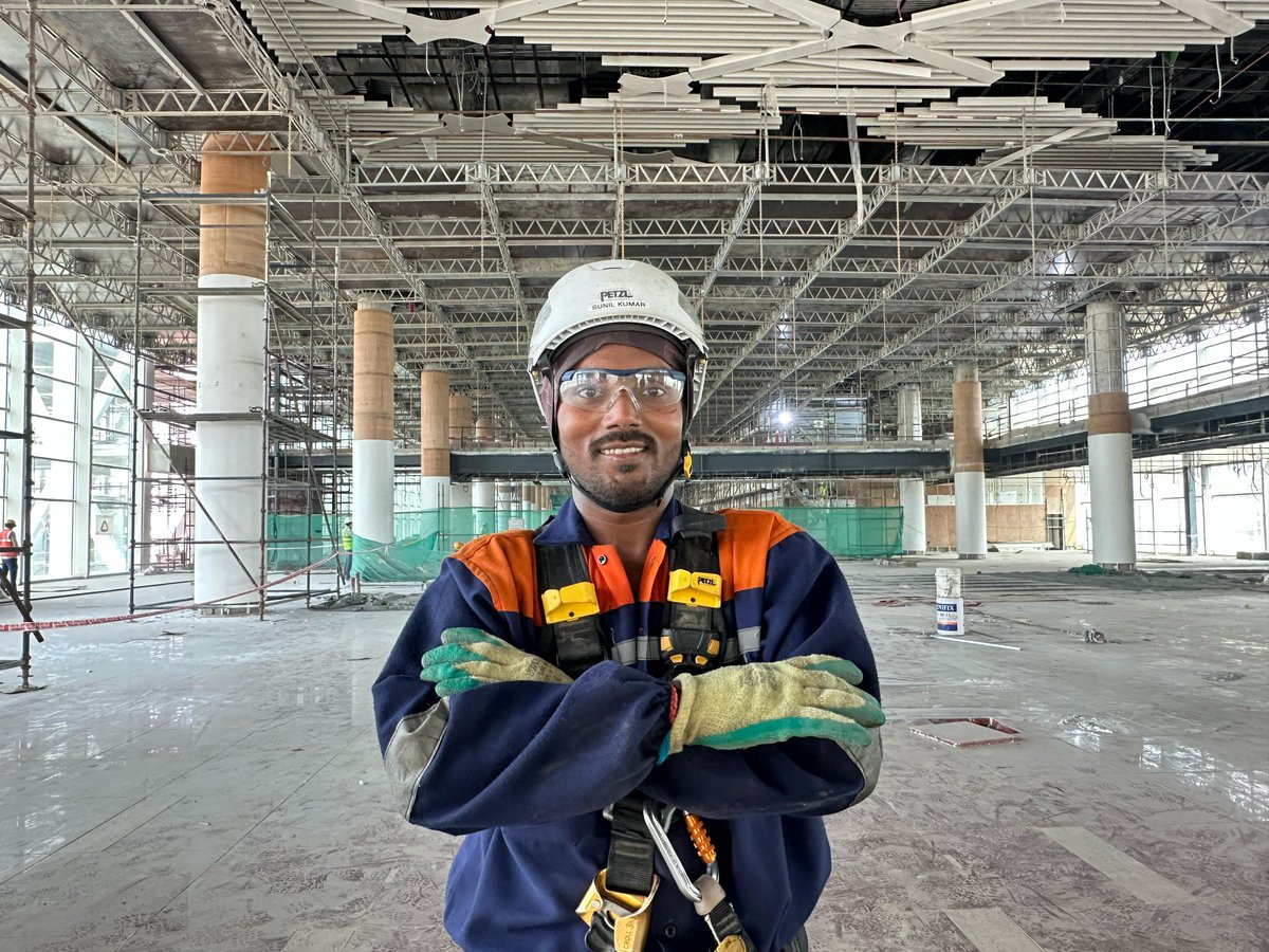 Meet Sunil Kumar, a hanging-deck technician whose precision and vigilance ensure that all suspended platforms are in place &amp; safe, allowing teams to take on complex façade works with confidence. A role rooted in responsibility and vital to our journey. #NIAirport #FromTheGroundUp
