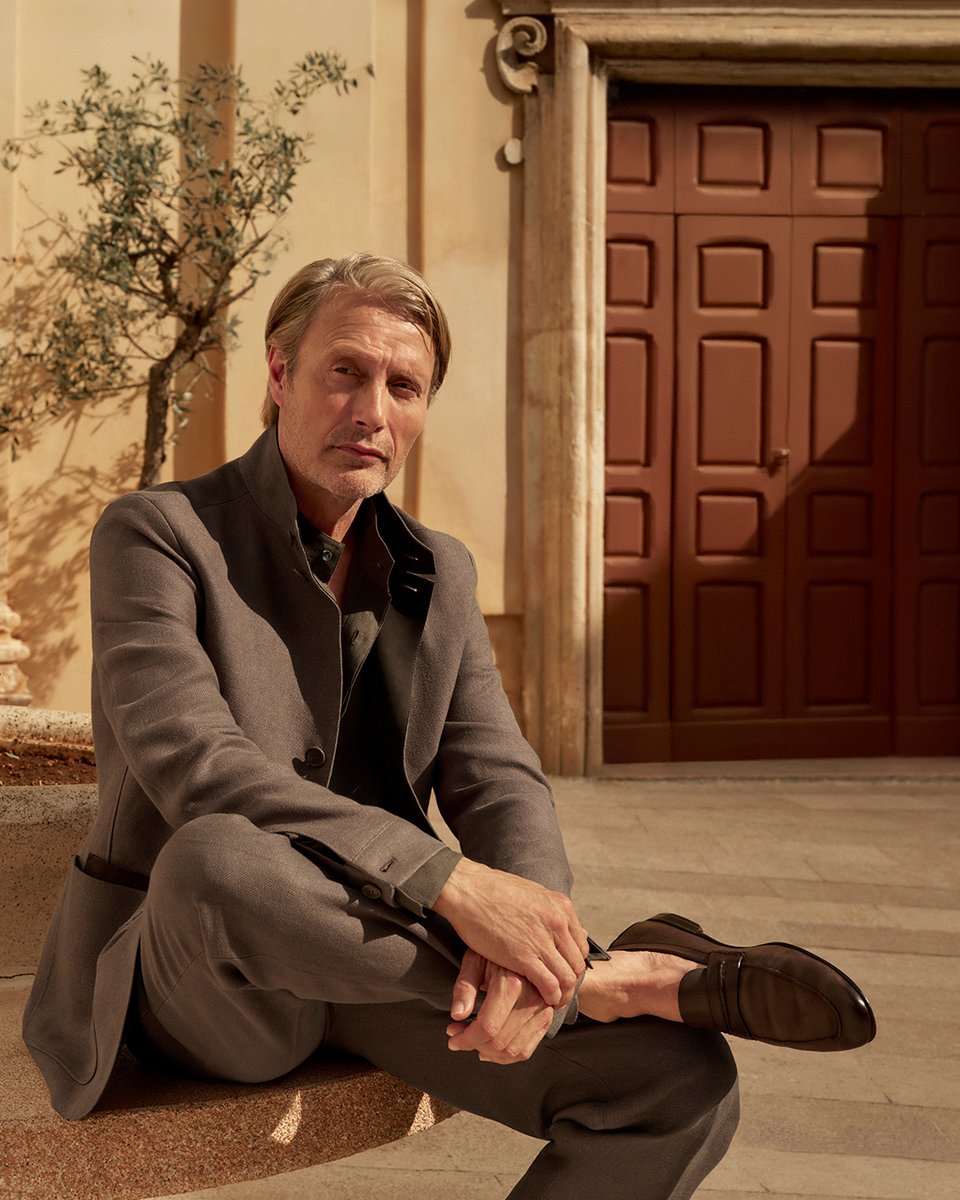 Zegna's tweet photo. MOCASSIN: BORN IN THE STREETS OF ITALY

In the evening sun, Global Ambassador Mads Mikkelsen leans into the Italianità of Mocassin, our new house loafer. Evolving over generations, it marks the values that have shaped ZEGNA's journey.

#ZEGNAMOCASSIN
#ZEGNASUMMER25 https://t.co/UBN2VIkAG4