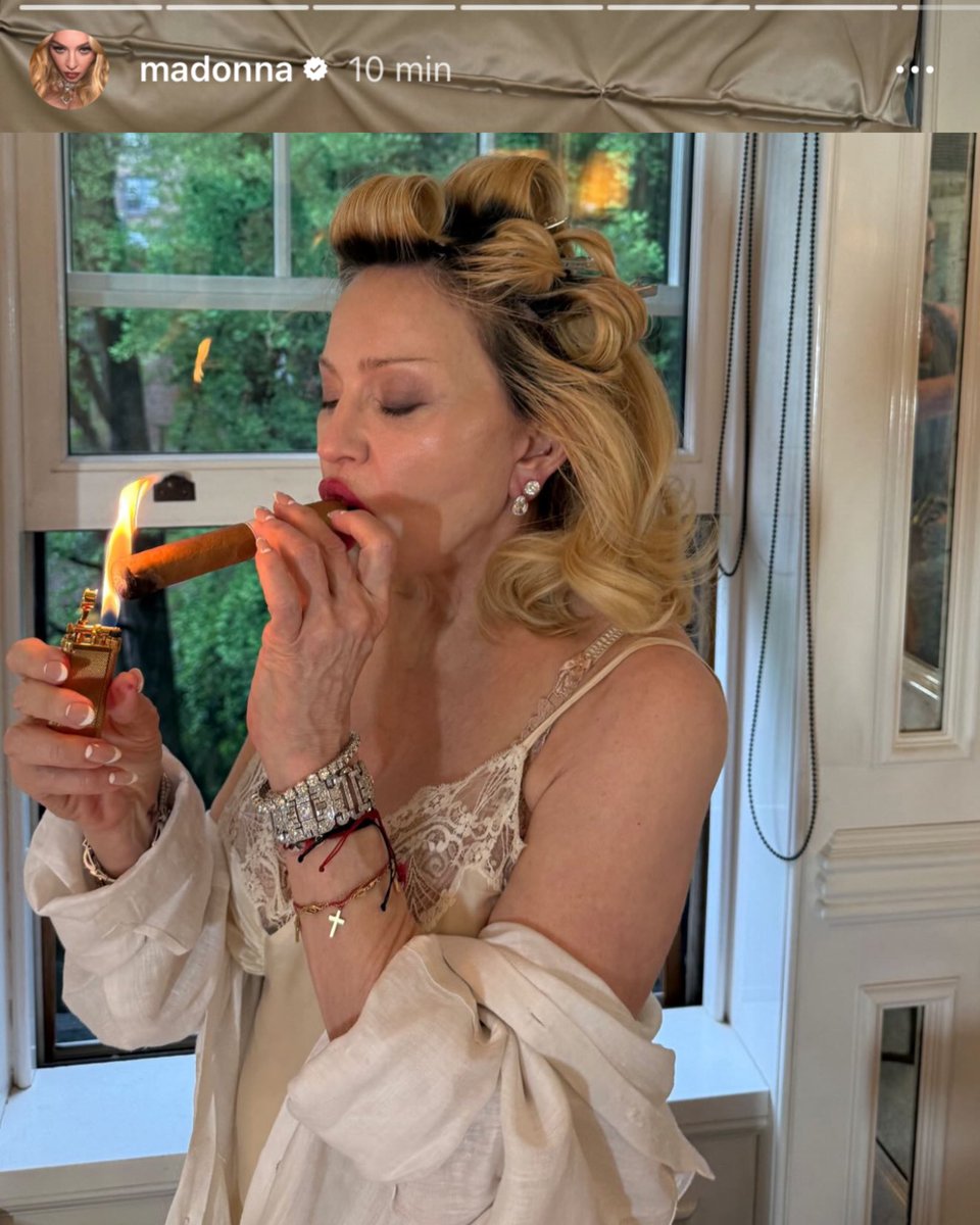madonna smoking a cigarette 🚨“A badass with no regrets, Madonna posts a new unfiltered photo, smoking  a habano, after the negative comments about her appearance at the Met Gala.  She doesn't care, that's why she's the