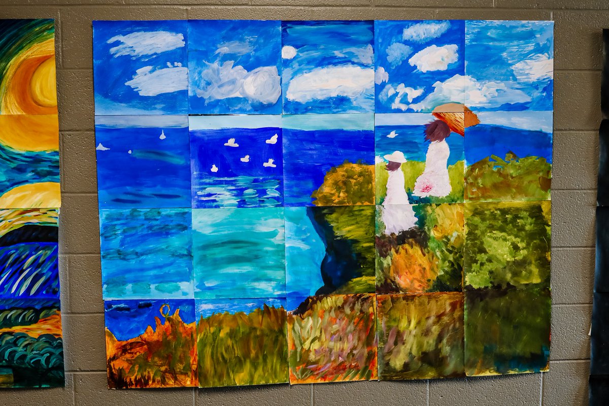 High school art classes displayed their final project as a multi- grid of famous paintings: A Starry Night by Picasso, The Cliff Walk at Pourville by Monet, and Girl with a Pearl Earring by Vermeer.