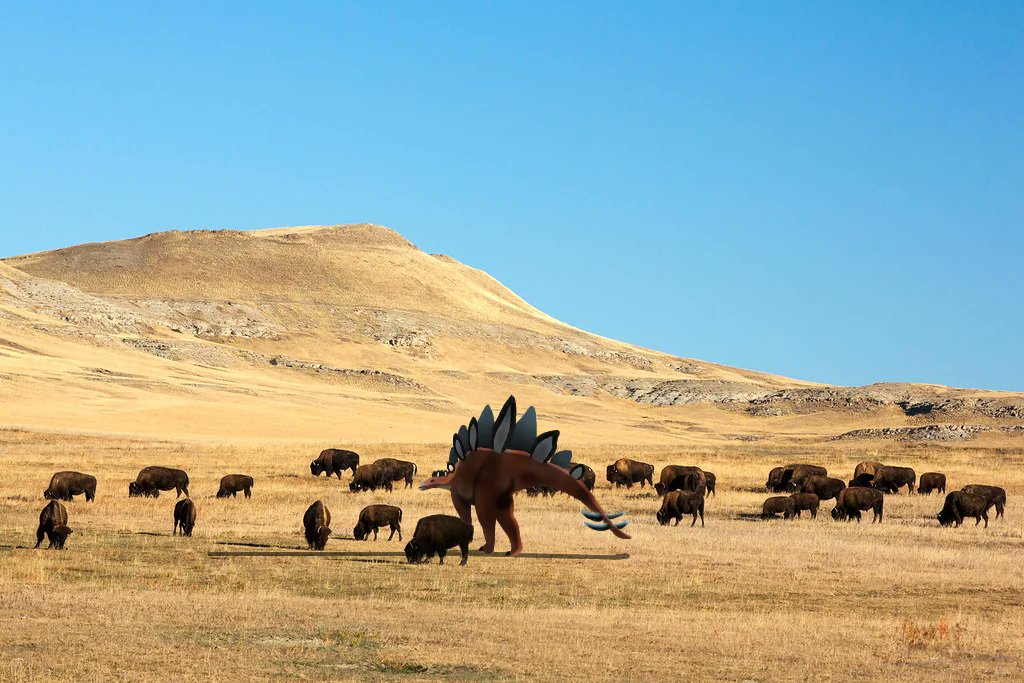 Stegosaurus accepted into a bison herd by u/Zillajami-Fnaffan2 link to og post in the comments