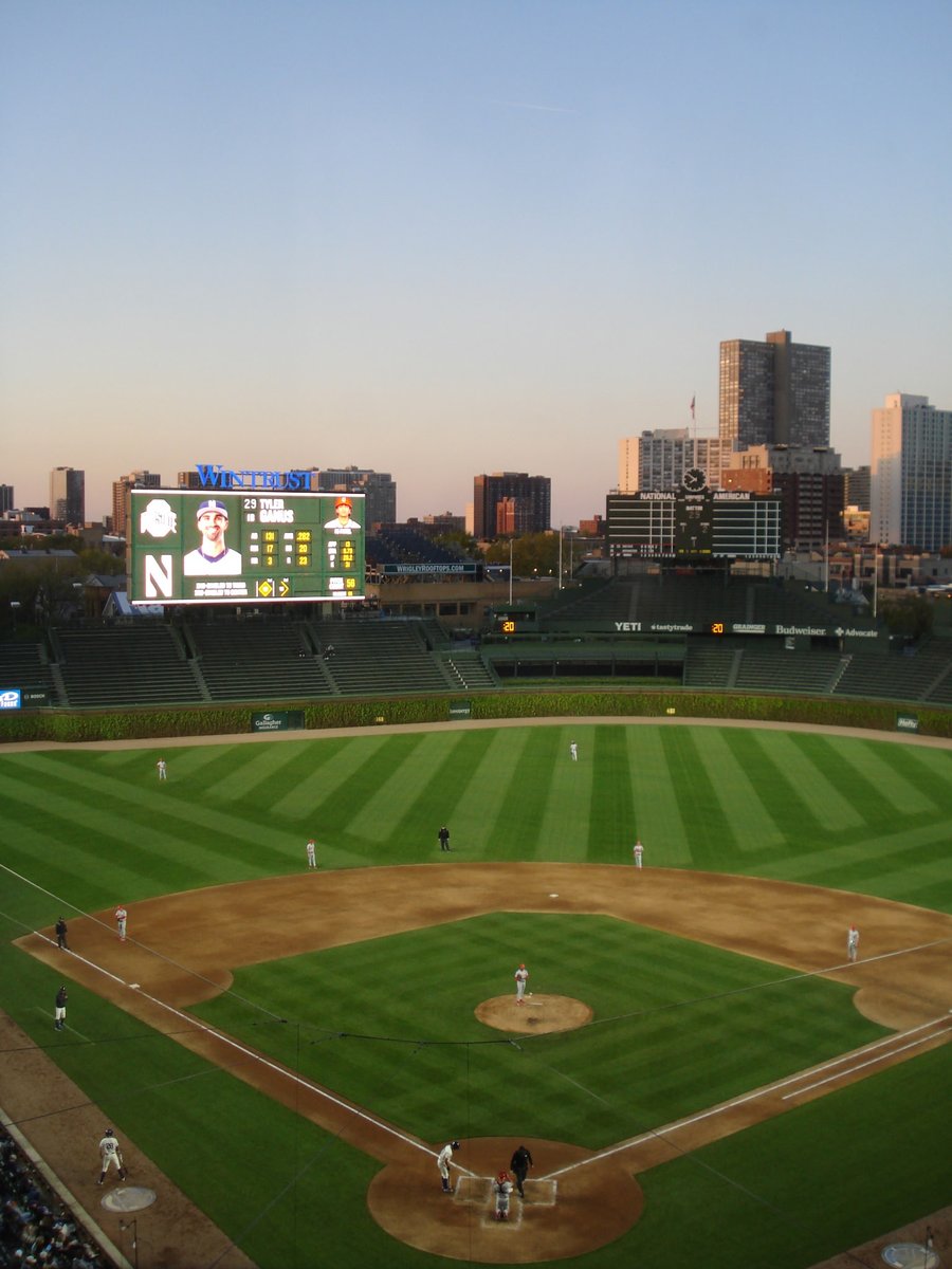 The sun is setting at Wrigley Field as the fifth inning comes to a close. 7-2 NU