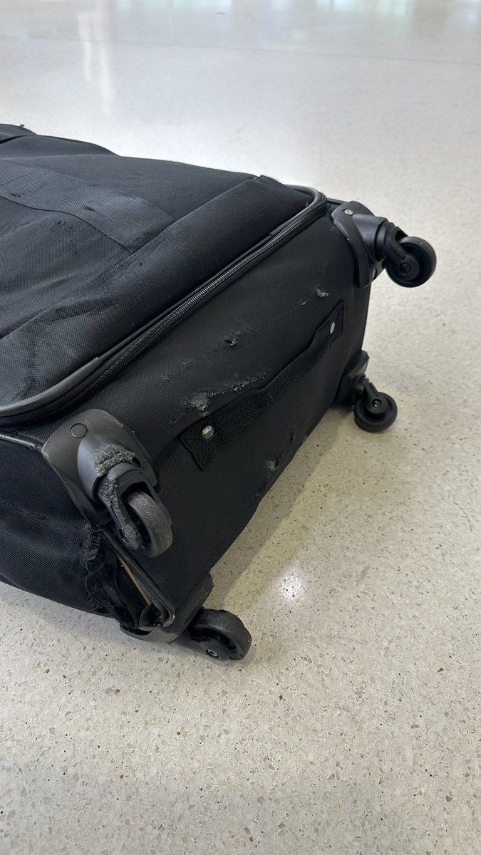 MamaCarlino's tweet photo. This is not ok @AmericanAir !!! My son’s suitcase was not like this when he checked it in yesterday morning at the @slcairport . Picked it up @BHMAirport and it’s destroyed! All his toiletries were destroyed as well. (Continued in comments) https://t.co/k8mVlHQ7dM