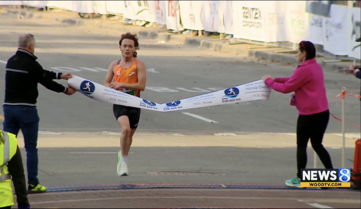 Ethan Gregg is victorious is the Amway River Bank Run 10K!