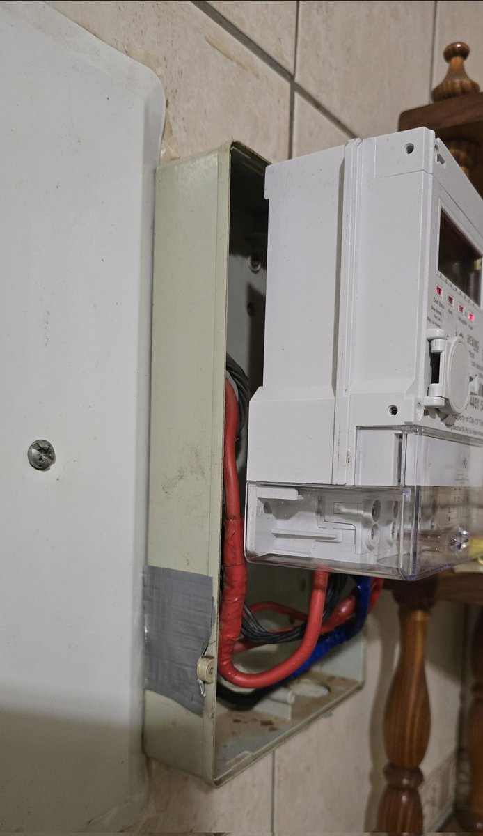 9iceFacts's tweet photo. @CityTshwane the workmanship by your contractor doing prepaid changes is shoddy, to say the least. The prepaid meter that was removed worked fine and had plenty of units in it. Look at the attached pics with wires exposed on my tiled kitchen. Are you proud of this? FIX THIS ASAP. https://t.co/660Tdlgfdi