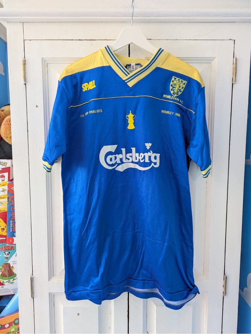 LMatthews_Poet's tweet photo. @AlanSurrey Hi 👋 

A friend of mine sent me a link to your X account.

I have an original Wimbledon home shirt from 1988 - the FA Cup Final edition. 

XL and in fantastic condition. 

Thought it may be of interest to you!

I'm retrokickoff on eBay, where it's currently listed 👍 https://t.co/1JG3YO58Xj