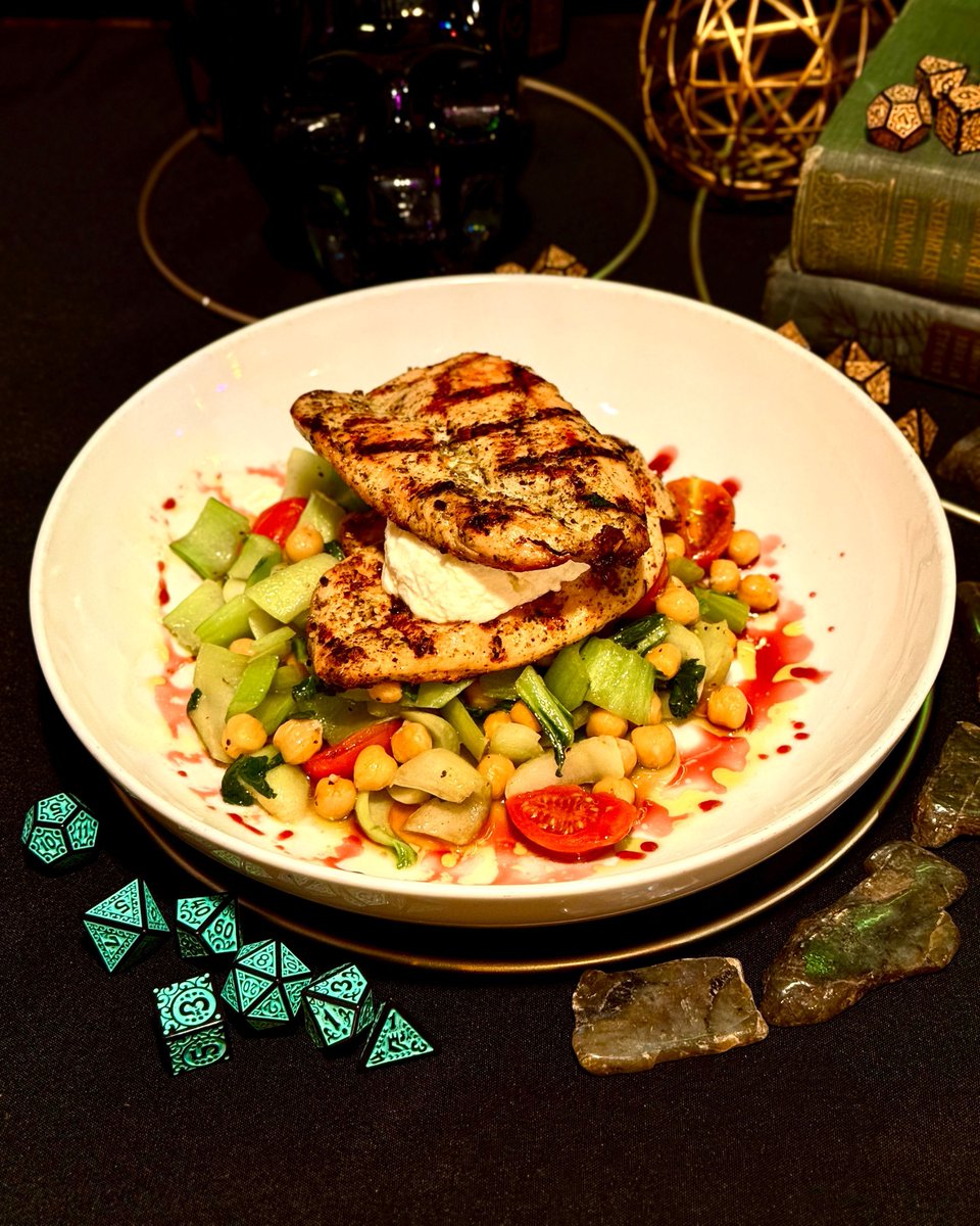 Introducing Braavosi Bazaar Chicken! Channel your inner faceless assassin with goat cheese-stuffed grilled chicken, sautéed bok choy, chickpeas, and grape tomatoes, drizzled with pomegranate molasses and basil oil - a dish for those who’ve mastered the art of disguise 🥷