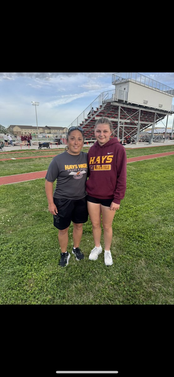 Kenlee Vehige w/ a school record Vault a couple weeks ago at 10’. Pictured with Coach Wolf.