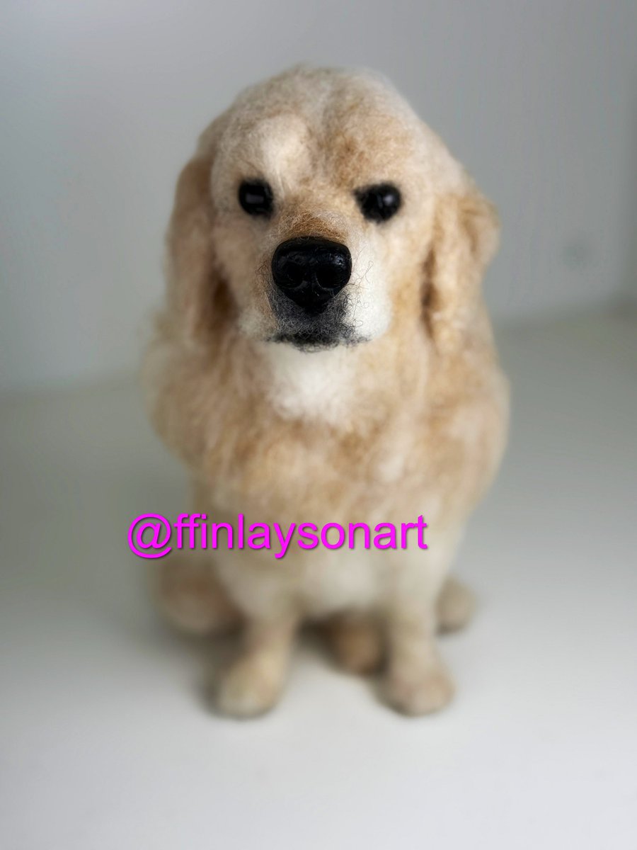 A needle felted portrait of a lovely golden retriever