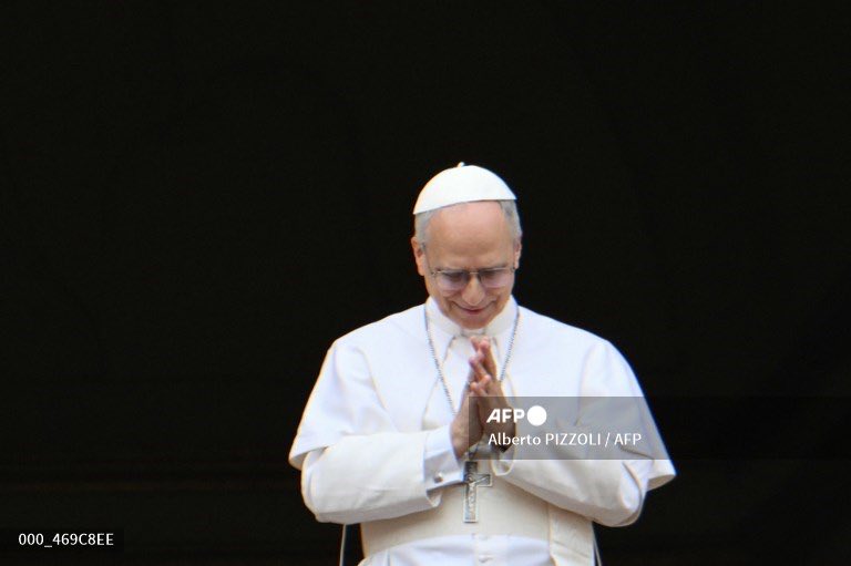 Pope Leo XIV greets the crowd during the Regina Caeli prayer from the main central loggia of St Peter's basilica in The Vatican, on May 11, 2025