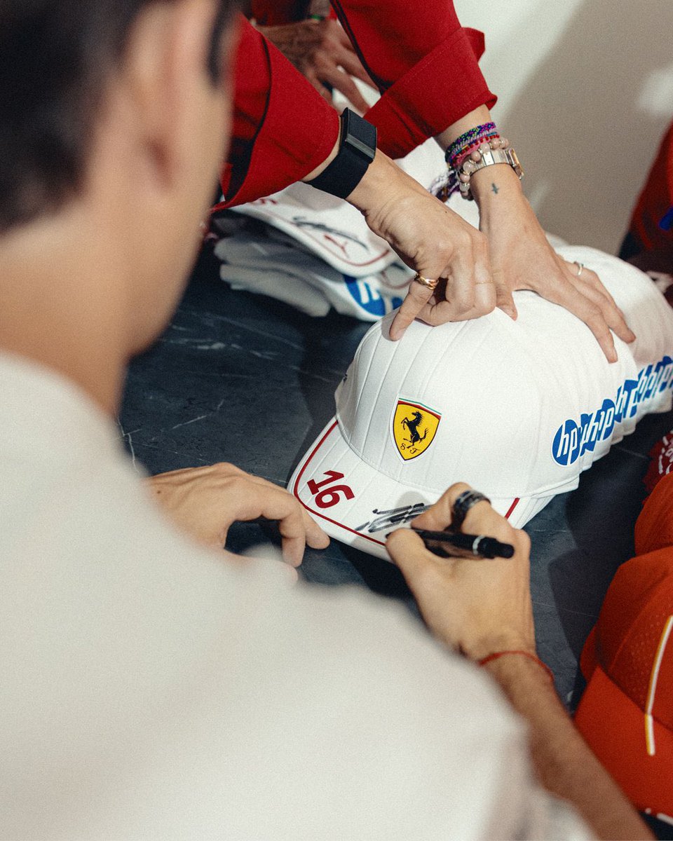Chfrles's tweet photo. Race weekend isn't just about driving. Photos, signing caps, meetings and somehow still making it to the paddock on time— all part of the job. https://t.co/0mE09NQ0PC