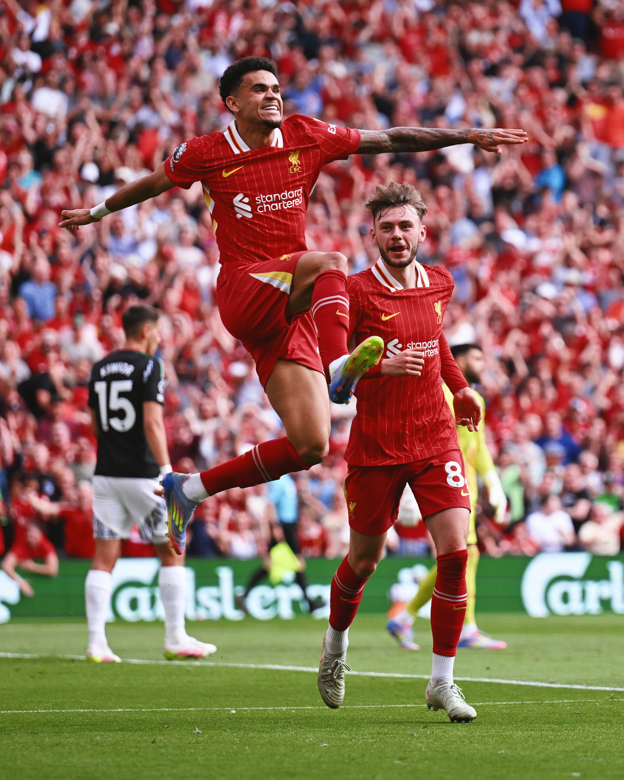 Photography of Luis Diaz celebrating his goal against Arsenal.