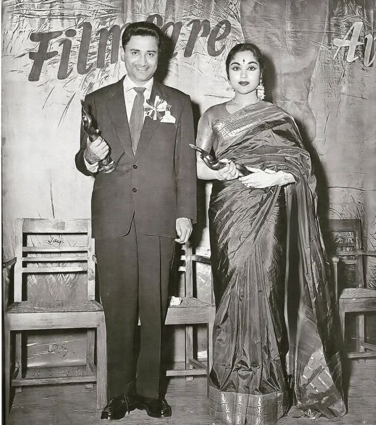 filmfare's tweet image. #FilmfareFlashback: #DevAnand and #Vyjayanthimala pose with their Filmfare awards at 6th Filmfare Awards, which took place in 1959.

#Trending