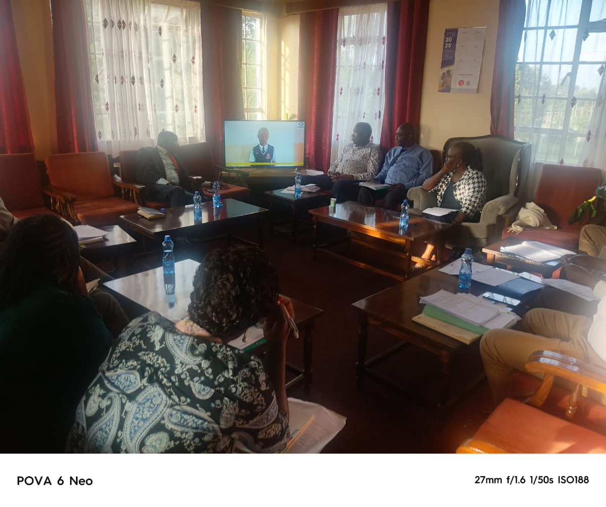 Participants follow up a video featuring the school activities of Elimu scholars at the Baringo High School