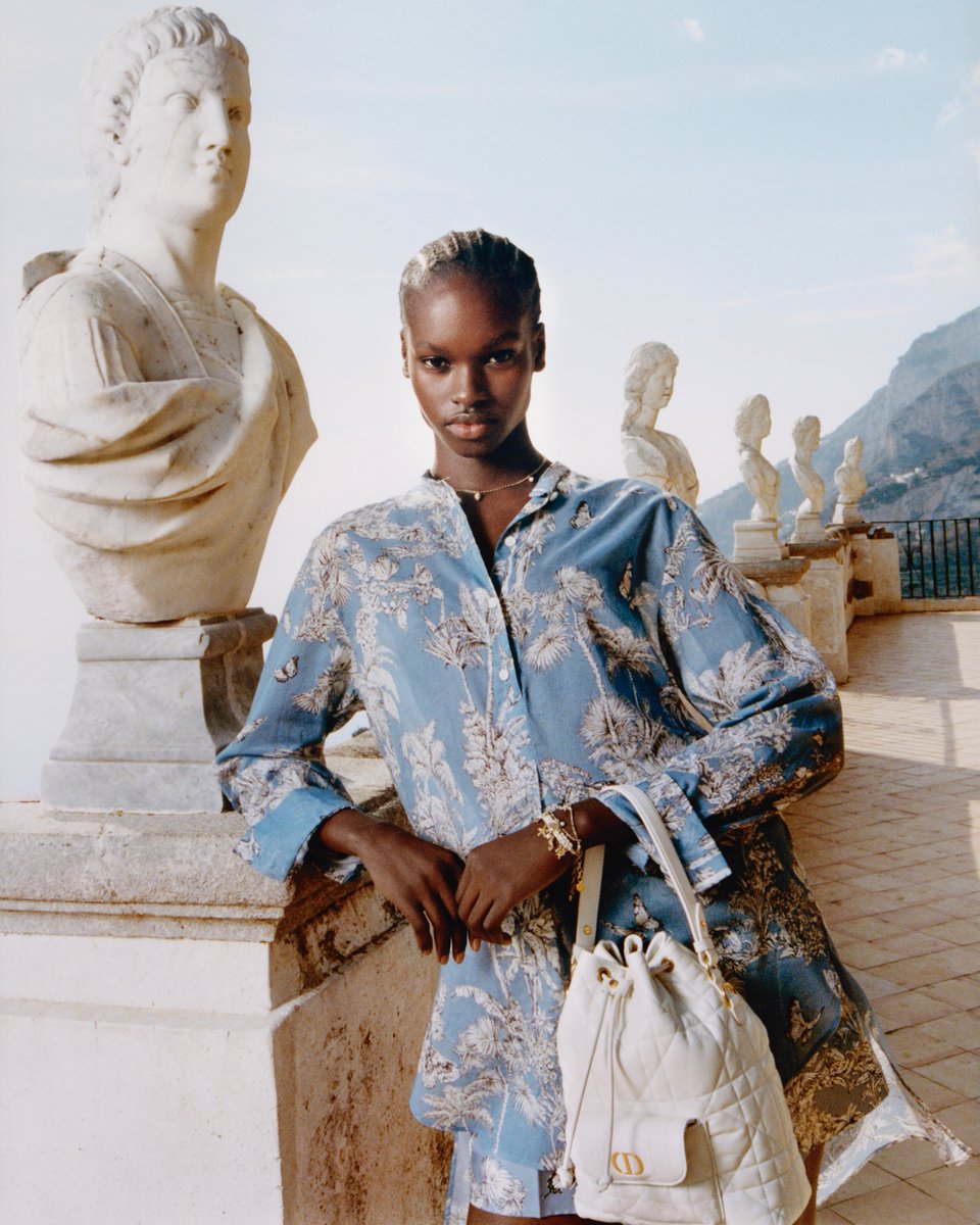 Dior's tweet photo. Bask in coastal charm with effortless allure – the Dior Caro Bucket bag and printed silk scarves within the #Dioriviera capsule from #DiorFall25 by Maria Grazia Chiuri shine in #DiorMagazine 50. View the edit https://t.co/SMG0bTS6FW or find it in select Dior boutiques. https://t.co/MsdLt64wHJ